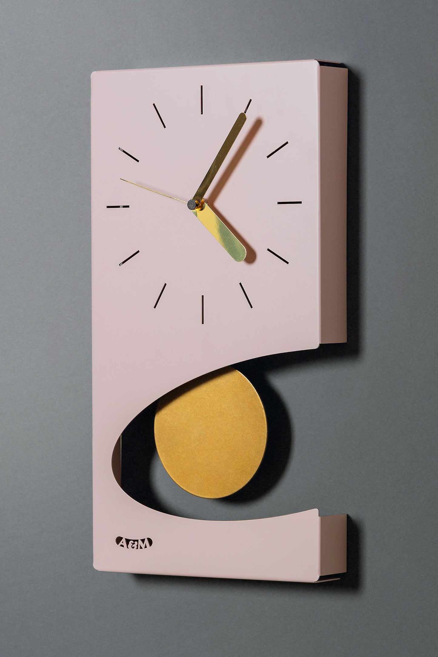 Horloge murale à pendule au design moderne Eclipse