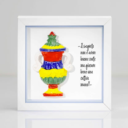 Quadro artigianale con Asso di Coppe delle carte napoletane in ceramica colorata e cornice bianca e interno azzurro